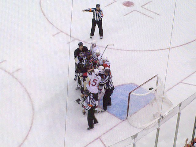 Pens and Senators having a meet and greet in front of the net.